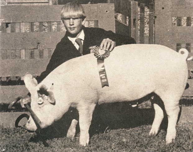 An FFA member proudly shows his pig during a past fair in this undated photo. - COURTESY DESCHUTES COUNTY FAIR & EXPO CENTER