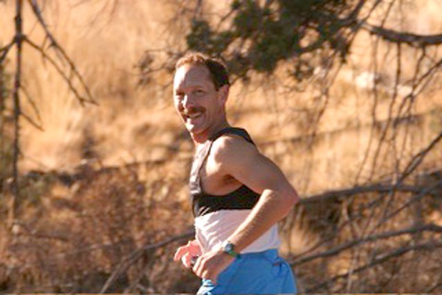 The author running the Oct. 10, 2004 "Just Around the Bend Marathon," where he finished 28th overall, &#10;and 1st in the 50-54 age group. - BOB WOODWARD