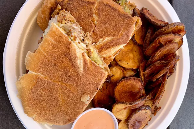 Shred Town Cuban sandwich with a side of spuds. - JOSHUA SAVAGE