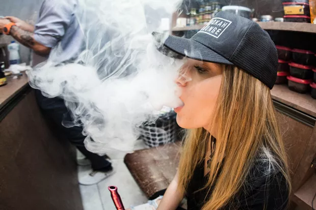 As this vaper regurgitates a thick, murky cloud, controversy over the practice mounts. - PIXABAY
