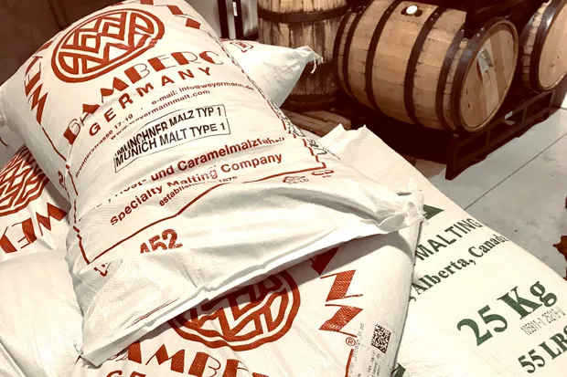 Bags of malted barley ready to be made into delicious beer. - ZACH BECKWITH