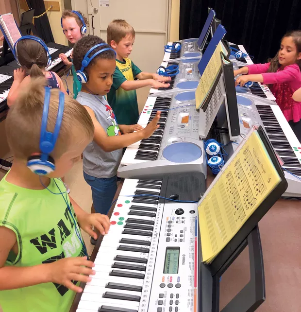Students at Ponderosa Elementary learn the ropes of the keyboard thanks to a grant from the Education Foundation. - SUBMITTED