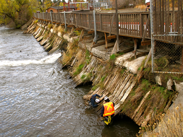 Workers checking out the Newport Avenue Dam in 2013. - SOURCE WEEKLY