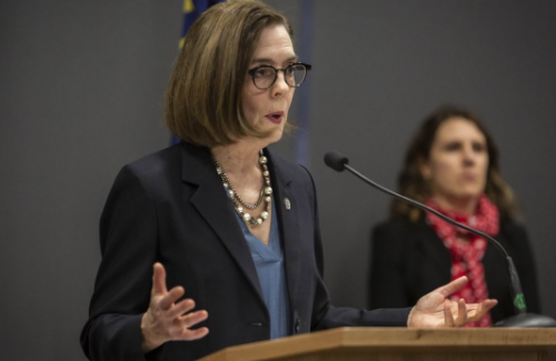 Gov. Brown, seen here during a news conference Friday, issued a more restrictive order this morning. - GOV. KATE BROWN