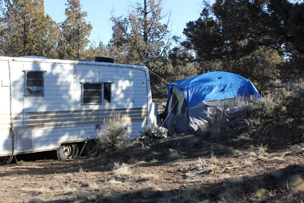 The dirt road leading out of Juniper Ridge was still open this weekend, allowing people to transport the last of their personal belongings off the property. - LAUREL BRAUNS