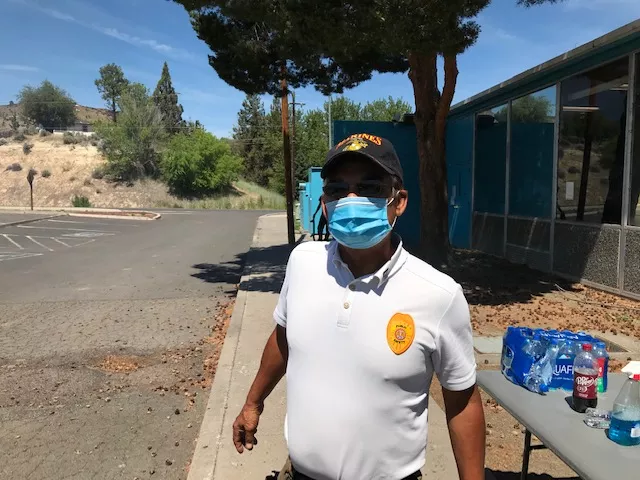 Danny Martinez works as the emergency manager for the Confederated Tribes of Warm Springs. On July 28, he's working one the many water stations he set up throughout the community to provide clean drinking water to the people on the reservation. - DANNY MARTINEZ