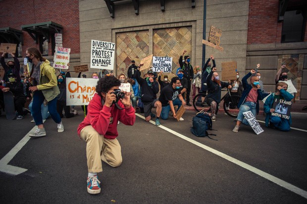 Maxwell Friedman snaps photos during a June 6 march on Bend CIty Hall that continued around downtown Bend - SOREN NYQUIST