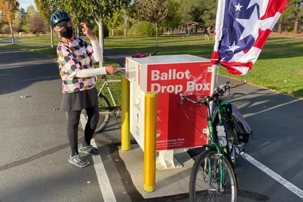 Floy Sitts places her ballot into the official box at Pine Nursery Park in Bend over the Oct. 17 weekend. All registered voters should have received their ballots by now. If yours hasn’t arrived, contact the Deschutes County Clerk. - RICHARD SITTS