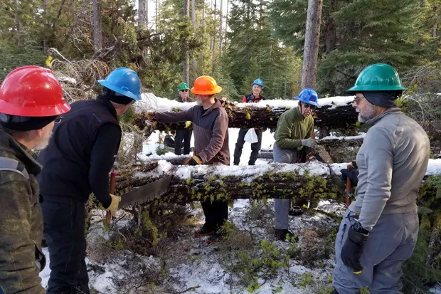 A team of volunteers works on clearing snowshoe trails. - CENTRAL OREGON NORDIC CLUB