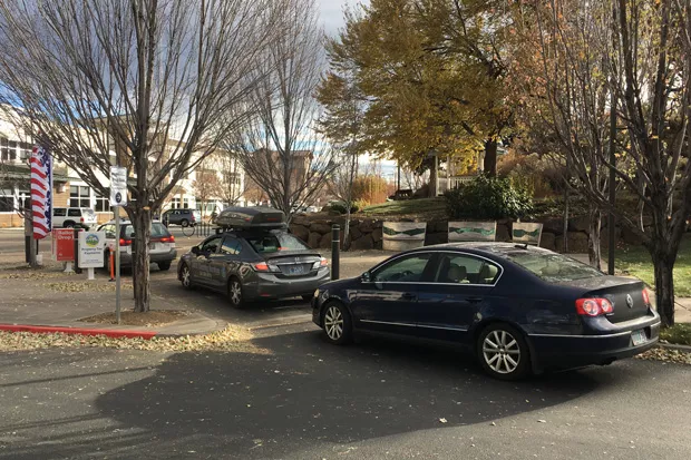 Cars line up outside the ballot drop site at the Deschutes County Services building Tuesday, dropping off those last-minute ballots. As of Tuesday afternoon, nearly 80% of eligible voters had already voted. - DARRIS HURST