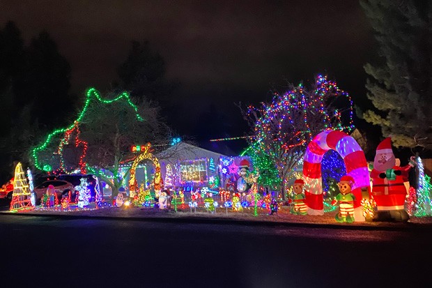 Is it Santa's workshop or just a helpful elf getting into the holiday spirit? Either way, this home on &#10;NE Meadow Lane in Bend gets an A for effort. - PHOTO BY NICOLE VULCAN