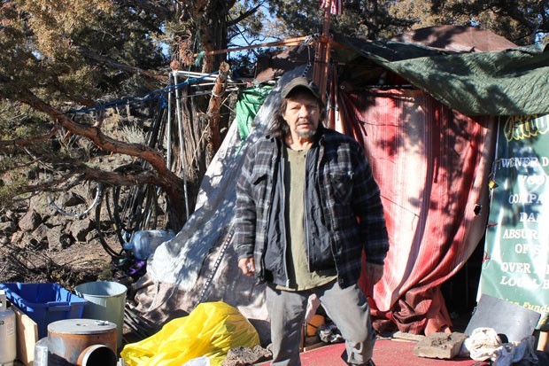 Jon Atkins stands outside of his tent at Juniper Ridge in northeast Bend. - LAUREL BRAUNS