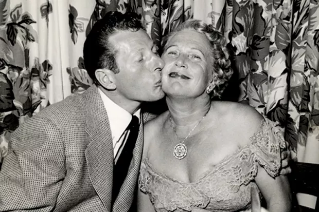 Actor Danny Kaye and friend Jennie Grossinger keep it real (and interesting) with this peck on the cheek, circa 1951. - COURTESY LIBRARY OF CONGRESS