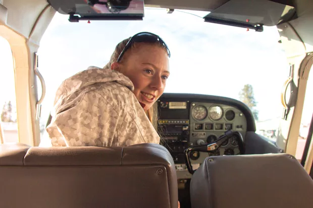 Mary Root prepares for takeoff inside the cockpit of her Cessna 120 tailwheel light aircraft. - KYLE SWITZER