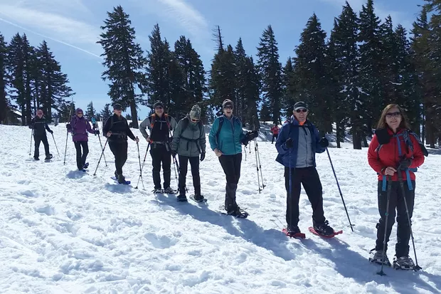 Skiers and snowshoers explore the winter wonderland in Crater Lake National Park. - DAMIAN FAGAN