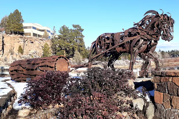 Bend's ironwork sculptures, including this one in Riverbend Park, are an homage to the city's lumber-mill history. - DAMIAN FAGAN