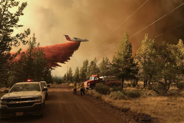 One of five large air tankers dropping retardant on the Grandview Fire on July 11. - COURTESY OF INCIWEB