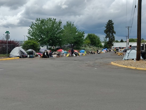 Camps line both sides of Emerson Avenue in Bend. On Wednesday, June 2, Bend City Council adopted policies that set criteria for the camp’s removal. - JACK HARVEL