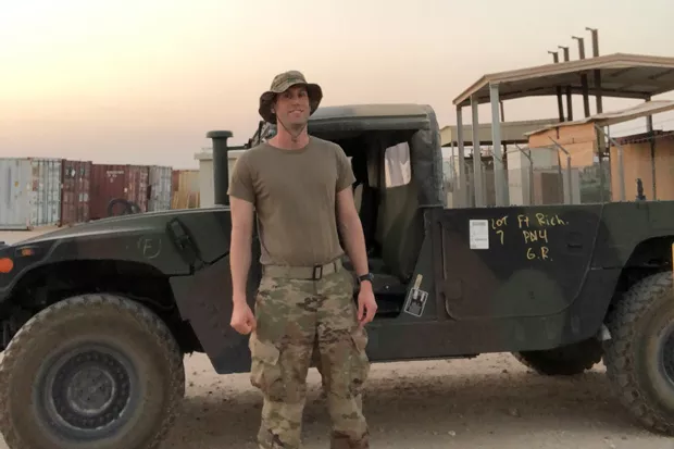 In a moment of calm Chris Browning basks in the triple-digit heat in Kuwait. - CHRIS BROWNING