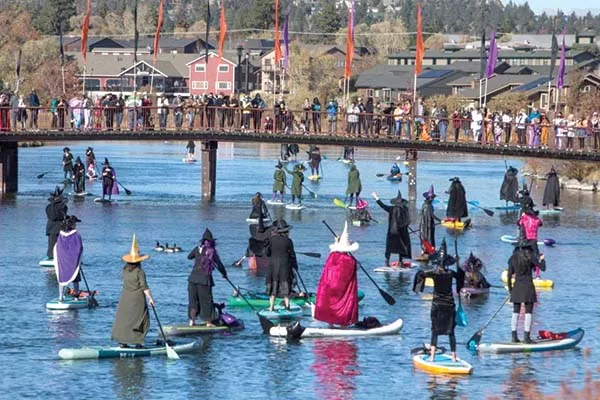 Risking getting wet and melting, this coven of witches takes on the cold Deschutes waters. - BEND PADDLE WITCHES FB