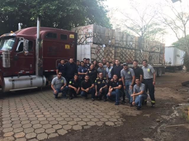 Condega Fire Chief Jaime Delgado Cultura and a crew of Nicaraguan "bomberos"—firefighters—stand in front of the equipment donated by the Bend Fire Fighter's Foundation. - COURTESY BEND FIRE FIGHTER'S FOUNDATION