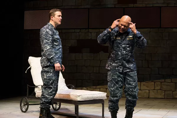 Othello, at right, played by Chris Butler, reacts to the cunning deceit by Iago, played by Danforth Comins. - JENNY GRAHAM