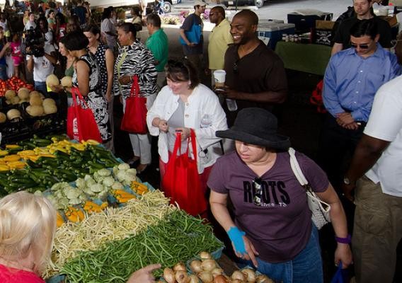 People shop at a farmers market in the U.S. Heartland - USDA