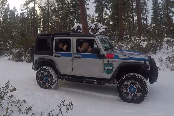 Customers enjoying a backcountry tour in "The Iron Patriot" driven by Central Oregon Jeep Tours owner Jay Harness. - SUBMITTED