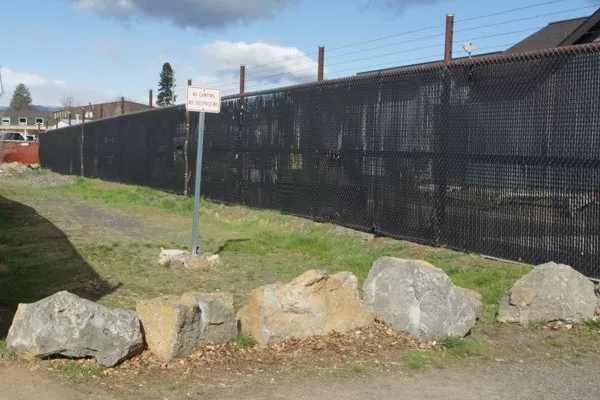 Vacant land sits between two businesses in the Bend Central District. - CHRIS MILLER
