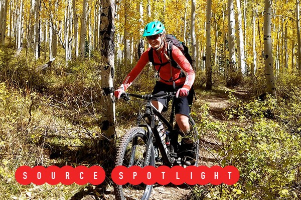 Jane Quinn rides her bike on a dirt trail. - SUBMITTED