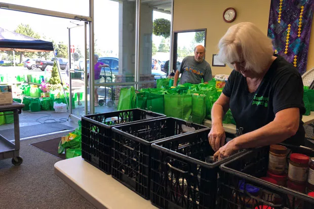 In just a few hours, volunteers collect, sort and send food to The Giving Plate. - LISA SIPE