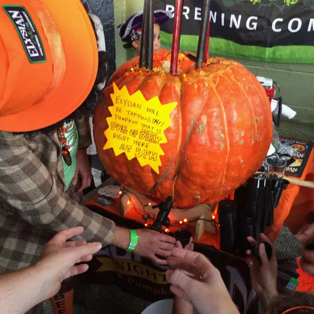 Tapping a pumpkin: The next grand autumn tradition. - PHOTO BY ELYSIAN BREWING