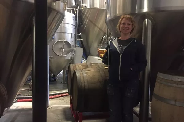 Tonya Cornett of 10 Barrel is at home among the fermenters. - KEVIN GIFFORD