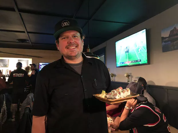 Chef Ian Skomski works solo in the kitchen at the pop up. - LISA SIPE