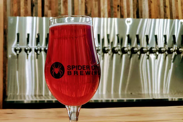 Spider City's taproom opens to the brewery. - HEIDI HOWARD