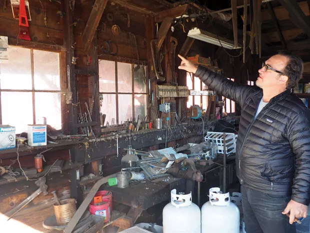 Belushi inherited Becca's shed, built from materials from Camp White, still full of bits and pieces that might have come in handy on the farm. - NICOLE VULCAN