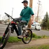 Bend Electric Bike's Rion O'Grady shows off his balancing skills, performing a no-handed trackstand on 5/5. Bend Electric Bike's Rion O'Grady shows off his balancing skills, performing a no-handed trackstand on 5/5.