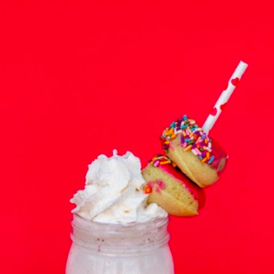 Honeysuckle Gelato’s ultra-‘grammable "Over the Top Shake for Two” with two mini glazed doughnuts by Suárez Bakery. $6.50 per shake.