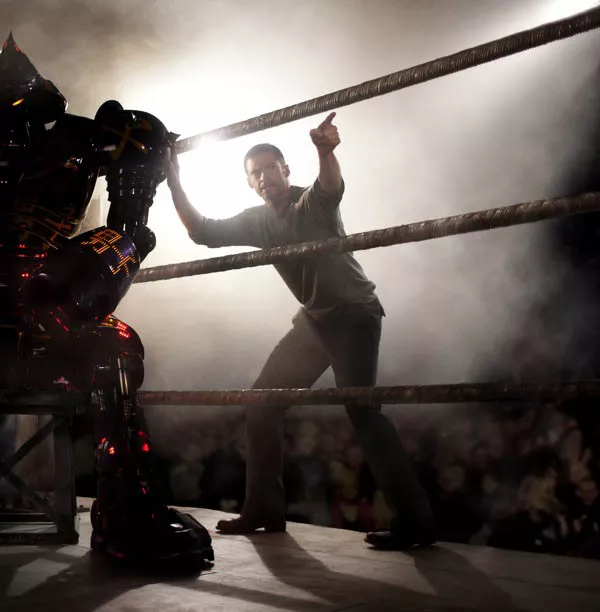 AND IN THIS CORNER: Charlie (Hugh Jackman) instructs his former league robot Noisy Boy in Real Steel.