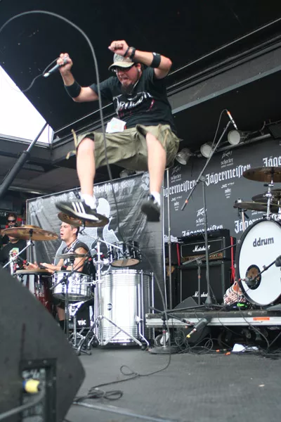 Ankla's Ikaro Stafford leaps off the drum riser. (Vans Warped Tour, Verizon Wireless Amphitheatre, July 23)