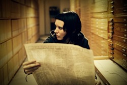 ANDERS LINDEN / COLUMBIA - BLACK AND WHITE AND DREAD ALL OVER: Lisbeth Salander (Rooney Mara) searches for clues while working on a particularly nasty case in The Girl with the Dragon Tattoo.