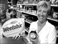 RADOK - C.C.A. BRITISH FOODS Owner Cathy Jones holding - the real British version of a popular cereal