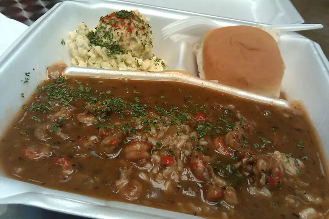 Daily special: Deliciously spicy Crawfish Etouffee, served with a bread roll and potato salad.