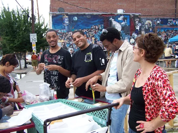 Diana Arvanites (right) with her Mobile Art Studio for Creative Disruption in NoDa, July 15, 2011