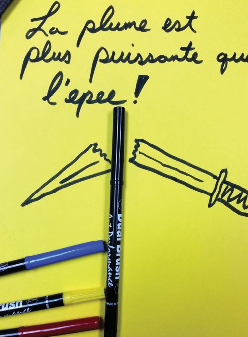 Dink Nolen creates doodles to help promote the local craft beer scene — never anything risky or political. But he felt compelled to take a visual stand. “The adage ‘The pen is mightier than the sword’ came to mind. So I quickly doodled a broken sword with those words in French, placed my pens with the doodle, snapped a picture, and tweeted it.” - COURTESY OF DINK NOLEN III