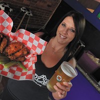 Ed's Tavern server Ashleigh Douglas with the Chuck Norris wings
