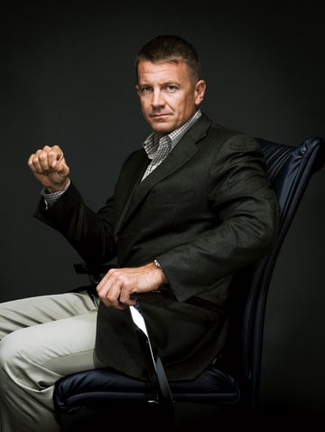 Erik Prince, practicing sitting in his seat on the next flight to the United Arab Emirates