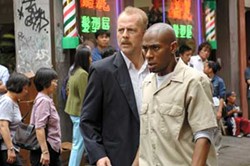 BARRY WETCHER / WARNER - FORGET IT, JACK. IT'S CHINATOWN. Jack Mosley (Bruce Willis) and Eddie Bunker (Mos Def) have little luck evading their pursuers in 16 Blocks