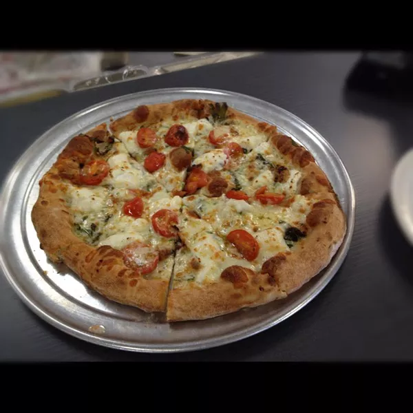 Fresh cherry tomatoes, ricotta cheese, arugula and sliced garlic