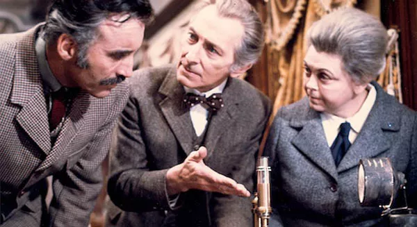 FULLY TRAINED: Professor Saxton (Christopher Lee), Dr. Wells (Peter Cushing) and Miss Jones (Alice Reinhart) examine the evidence aboard the Horror Express. (Photo: Severin)